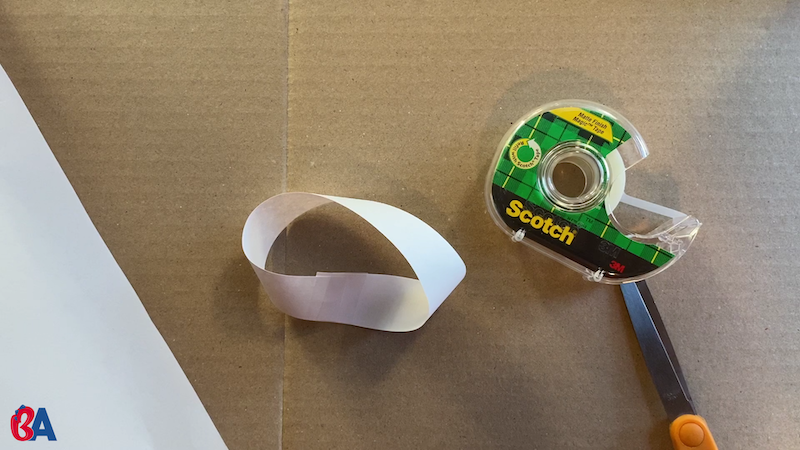 Mobius strip with tape and scissors