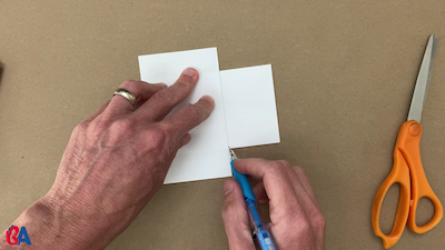 Drawing a line using the top index card as a guide