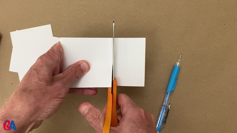 Cutting along the line on the index card