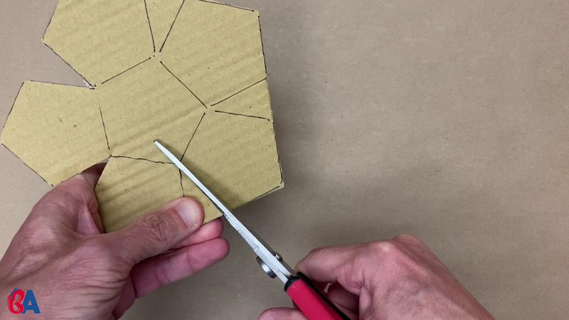 Cutting out the little triangles between pentagons