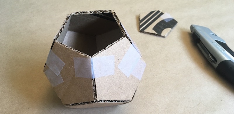 Cardboard dodecahedron with top face missing