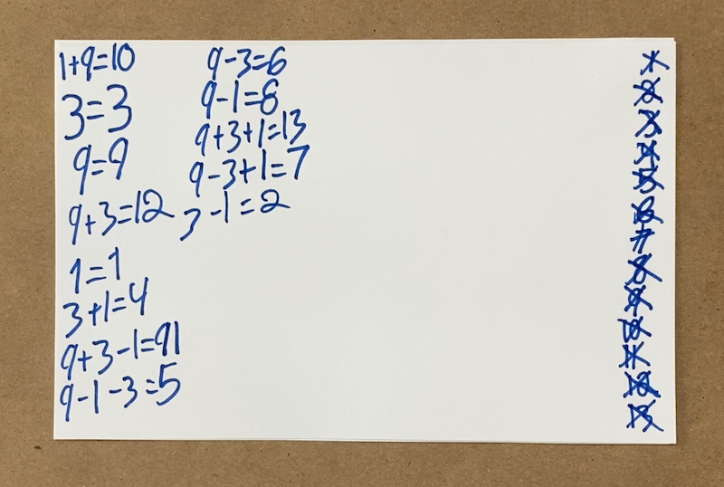 Equations written on a score card with all numbers crossed off the list